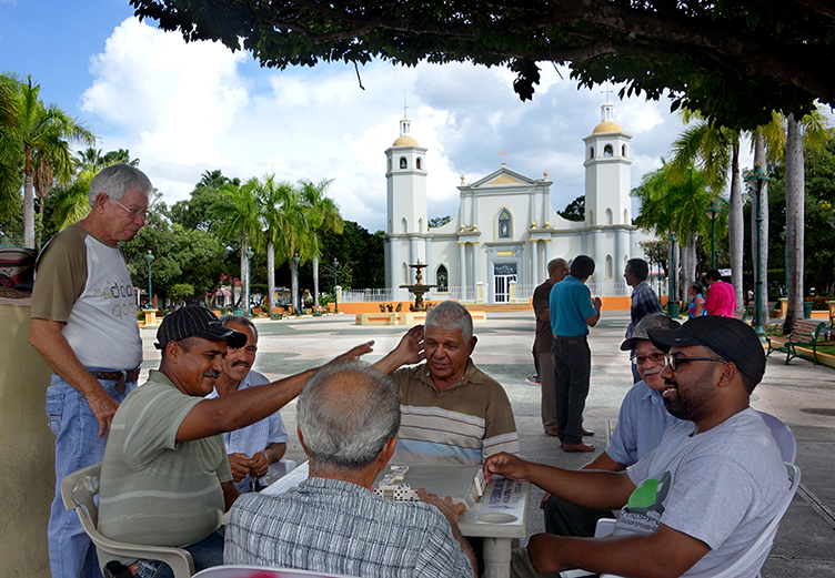 Playing dominos on the plaza in Guayama
